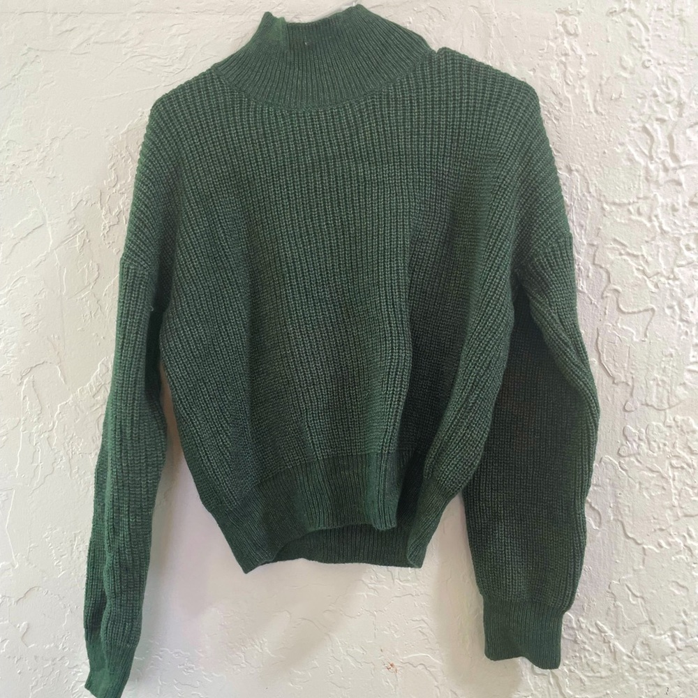 Green knit turtleneck sweater
